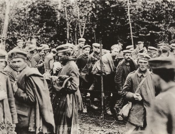 Group of German prisoners captured by the 125th Regiment Infantry (formerly 33rd and 31st Regiment Michigan Infantry) and 126th Regiment Infantry (formerly 31st and 32nd Regiment Michigan Infantry), 32nd Division on the morning of October 9, 1918 in the Argonne Woods near Montfaucon, Meuse, France.