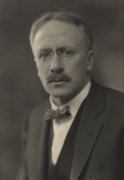 Quarter-length studio portrait of Edward Bennett, a professor of Electrical Engineering at the University of Wisconsin.