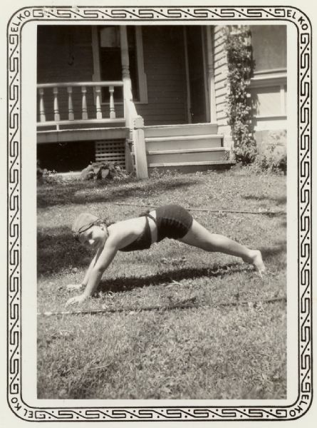 A child is posing, perhaps in mid push-up, in a front yard. A caption identifies the child as Rudy Vertiska.