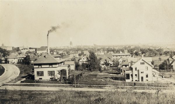 University Heights looking northeast from Ely Place. In the far distance  is the construction of the Wisconsin State Capitol dome.