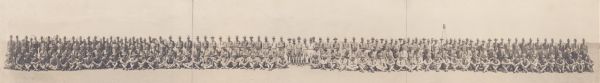A panoramic group portrait of a military unit at Camp MacArthur.