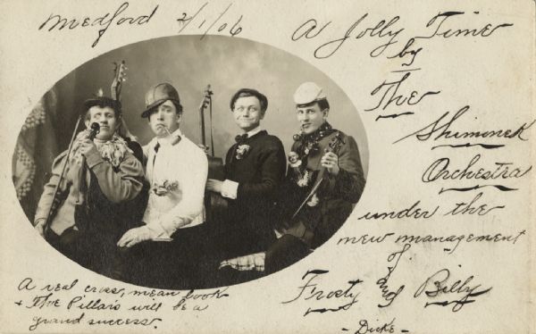 Postcard featuring an oval-framed group portrait of a four-person band. The members are posing comically with their instruments. Caption reads: "Medford 2/1/06. A Jolly Time by The Shimonek Orchestra under the new management of Frosty and Billy Dicke. A real cross, mean look & The Pillars will be a grand success."