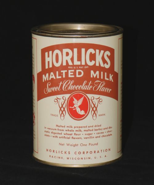 A front view of a can of Horlicks Malted Milk in "Sweet Chocolate Flavor." The can has a red trademark and lists the malted milk ingredients. 