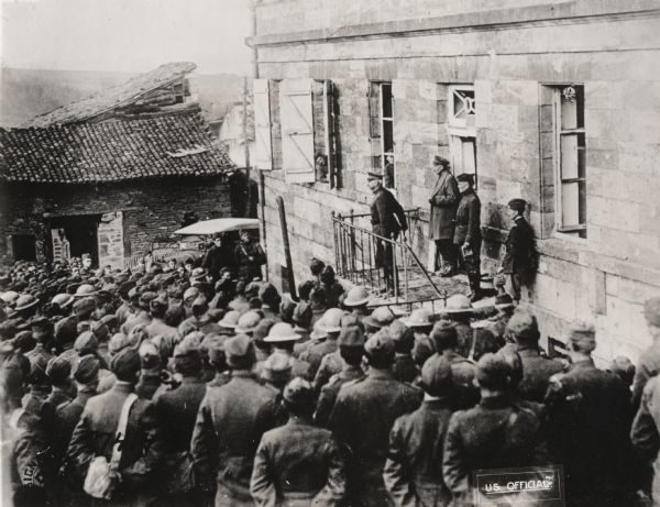 Major General William G. Hahn, commander of the 32nd Division, with Brigadier General Edwin B. Winans, congratulating officers and noncoms of the 127th Infantry, 32nd Division on their good work and giving them instructions as to their future task of following up the Germans. Bréhéville, Meuse, France.