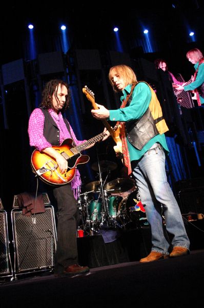 Guitarists Mike Campbell (left) and Tom Petty playing together during a performance at the Alliant Energy Center with their band Tom Petty and the Heartbreakers.