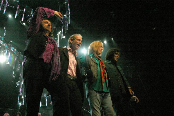 Tom Petty and the Heartbreakers taking a final bow after a performance at the Alliant Energy Center. From left to right are guitarist Mike Campbell, keyboardist Benmont Tench, Tom Petty, and bassist Ron Blair. 