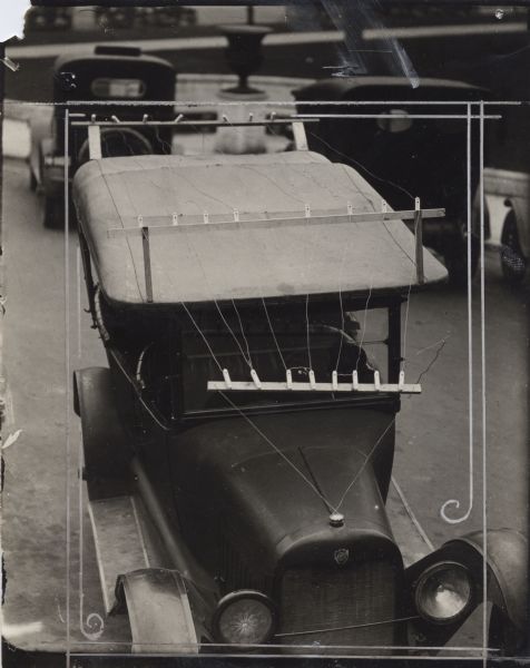 First car equipped with a radio to operate in Wisconsin. This view of the front shows the aerial antenna which spans the hood and extends over the roof of the vehicle.