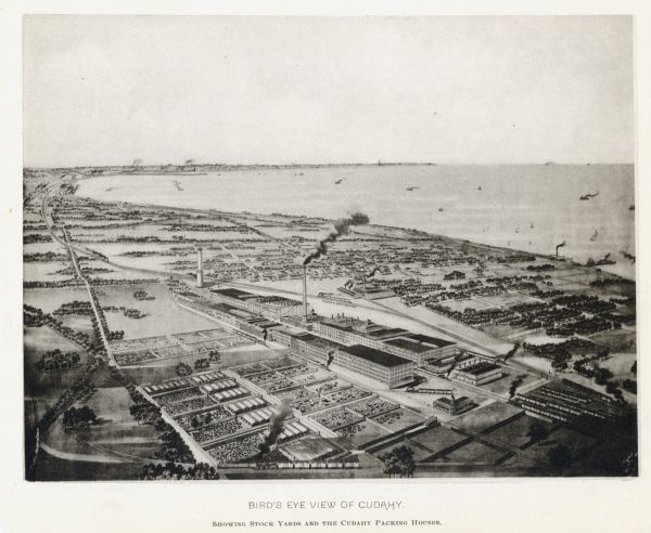 Bird's-eye view of Cudahy showing stock yards and the Cudahy packing houses. A train runs through the center of the image on the Chicago & Northwestern Railway. Many other trains on other rails appear throughout the map. Several ships can be seen in the distance on Lake Michigan.