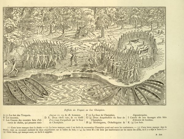 Illustration of an elevated view of a battle between Iroquois tribe and French on the banks of river. The Iroquois are unclothed and armed with bows and arrows, while the French are wearing armored clothes and are armed with guns. Three Iroquois are lying dead on the ground. Several canoes line the shore. A sleeping shelter and hammocks strung between tree stumps are at right, surrounded by a fence.