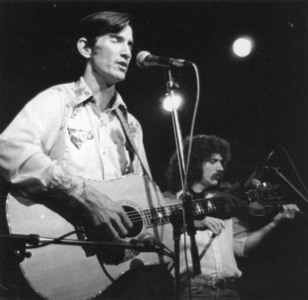 Townes Van Zandt (left) playing guitar and singing at Bunky's. Owen Cody is playing violin with Van Zandt.