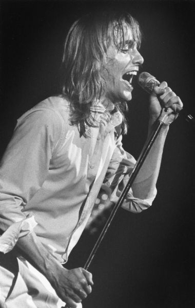 Robin Zander singing during a performance with his band Cheap Trick.