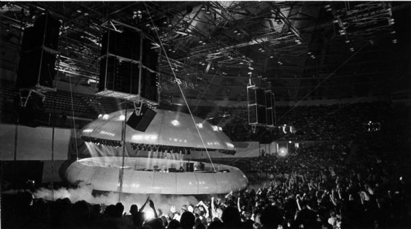 Elevated view of the Electric Light Orchestra's (ELO) stage prop space ship opening up with the band inside. This was at the beginning of a concert at the Dane County Coliseum, now the Alliant Energy Center.