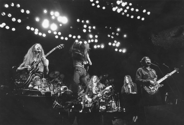 A double exposure or altered print of The Doobie Brothers performing in concert.