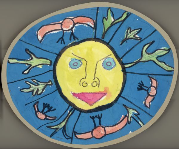 Young student's crayon and watercolor art inspired by Earth Day, consisting of a sun with a smiling face surrounded by a field of blue filled with birds and plants.