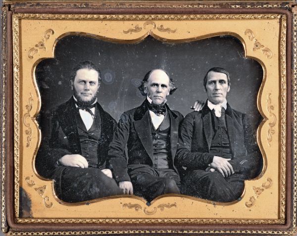 Half plate daguerreotype of Edward Harwood, William Brisbane and Levi Coffin sitting together. The three men were working together as antislavery activists.