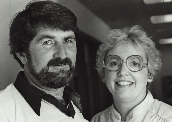 Close-up head and shoulders portrait of a man and a woman. Caption at bottom reads: "Larry & Sherry Hawkinson," with Larry and Sherry circled.