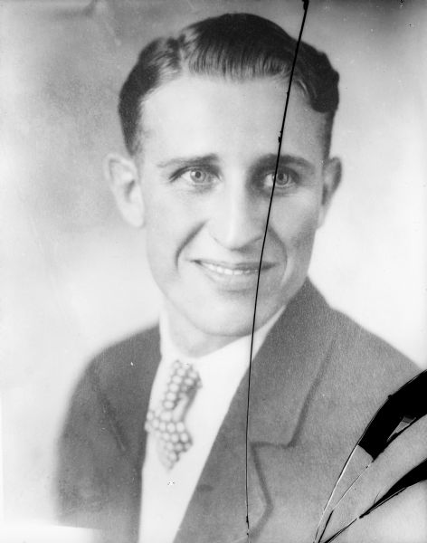 Copy of portrait of man wearing a suit with a polka dot tie, taken for Mr. Patrick.