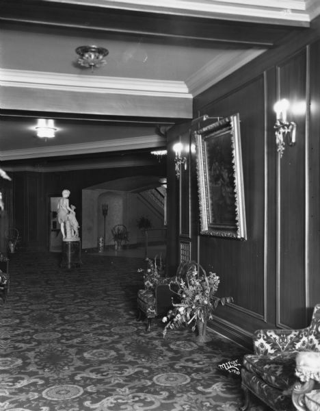 Orpheum Theater, at 216 State Street, showing the foyer from the west towards a statue of a boy with a goat on a pedestal.