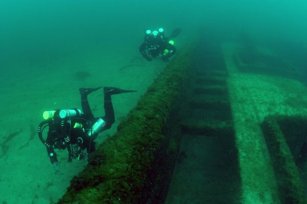 Archaeologists examining the wreckage of the <i>Lumberman</i> at the bottom of Lake Michigan.