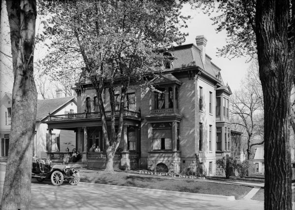 The John J. Suhr residence, 121 Langdon Street, built in 1886 for immigrant John J. Suhr, Sr. (1836-1901), who in 1871 founded the German-American Bank, later renamed the American Exchange Bank. A group of women are sitting on the front porch. It remained in family hands until 1957 and was designated a city landmark in 1874. At left is the W.H. Watson house, one of the first houses on Langdon, erected in 1858 and demolished in 1926.