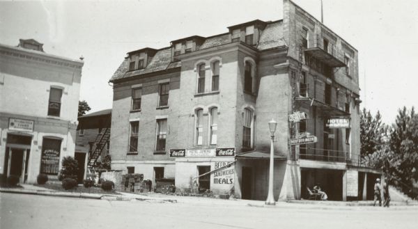 View across street towards the hotel. Caption in album reads: "Where I roomed 6-26 1946 while installing dial switchboard for Dairyland Milk Coop."