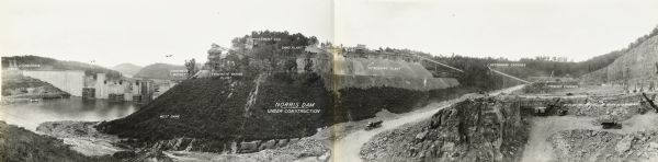 An elevated, panoramic view of the construction of the Norris Dam. Portions of the image are labeled. 