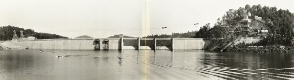 Elevated, panoramic view across water towards the Norris Dam. Portions of the image are labeled.