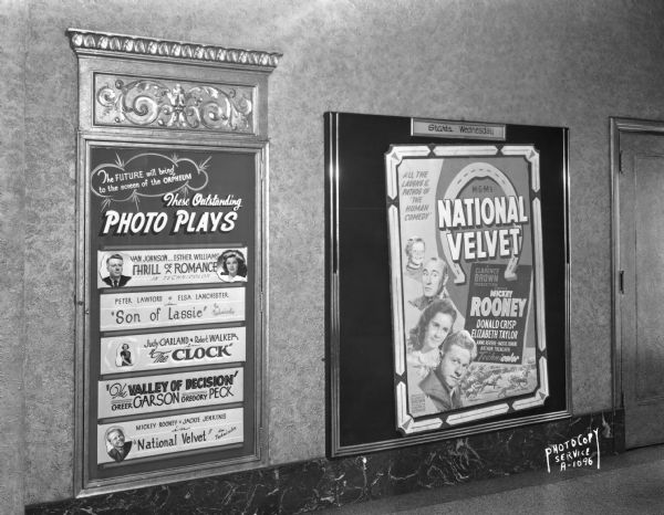 Lobby of the Orpheum Theatre, 216 State Street, showing a display of coming MGM movies, and a poster of "National Velvet," starring Mickey Rooney, Donald Crisp, and Elizabeth Taylor.