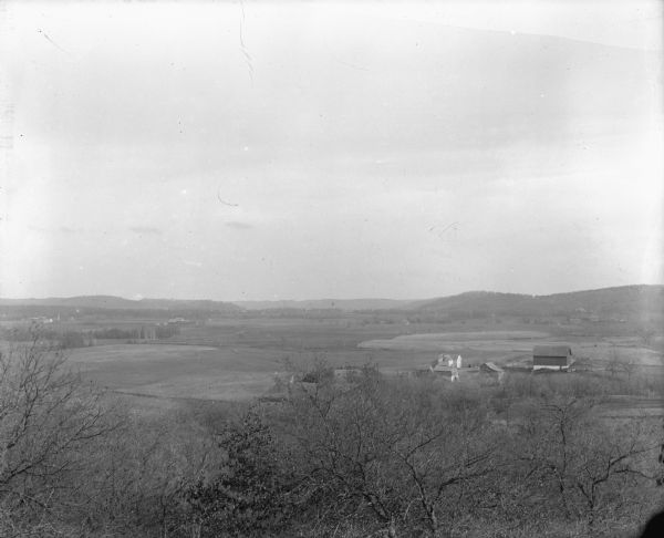 Elevated view. Caption on negative sleeve reads: "Black Hawk Battlefield. Wis. Heights. Looking N. of E. up valley towards Catholic Church. Mrs. Charles N. Brown Estate."