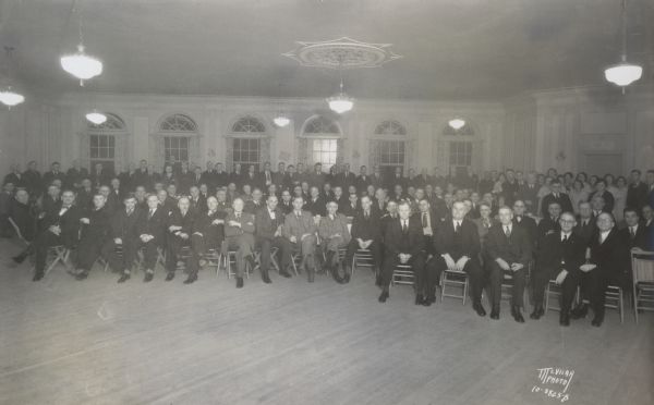 Group portrait of Chicago & North Western railroad engineers at a banquet at Schenk's Hall in the Schenk-Huegel building, corner of 2005 Winnebago and 2028 Atwood Avenue.