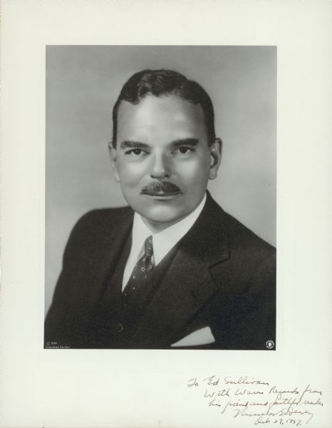 Portrait of New York Governor Thomas E. Dewey. He is looking directly at the camera and is wearing a three piece suit with a white shirt and white handkerchief in the breast pocket. The handwritten inscription reads: "To Ed Sullivan/with warm regards from/his friend and faithful reader/Thomas E. Dewey/Oct. 29, 1947."