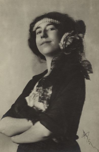 Waist-up portrait of opera singer, Olivia Monona (Olivia Goldenberger) likely in costume for an unknown production.