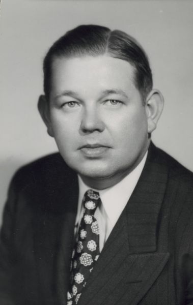 Quarter-length studio portrait of Frederick Meyer. He was president of Red Dot Foods, Inc., which produced Red Dot Potato Chips. 