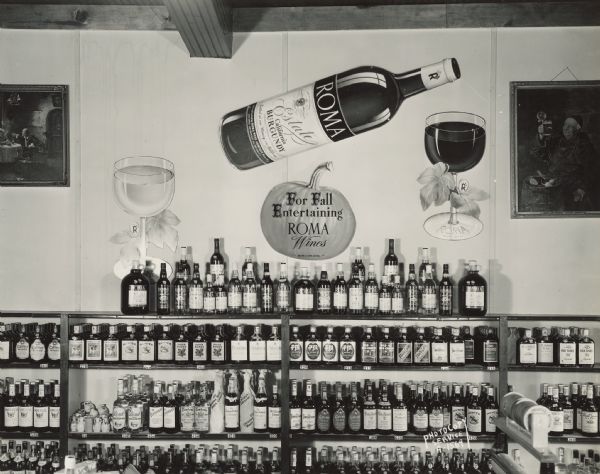 Roma Wine display on the backbar at the Malt House Tavern, 1603 Sherman Avenue, including a sign which reads: "For Fall Entertaining, ROMA Wines."