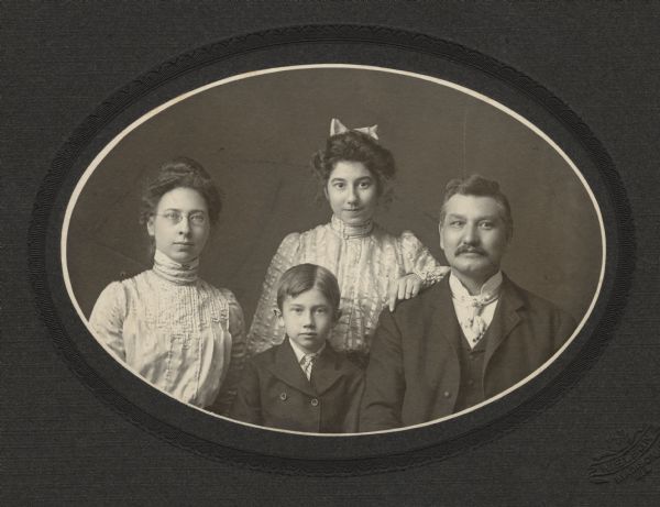 Oval-framed group portrait of the Goldenberger family of Madison. Estelle ("Stella" Moessner), Benjamin (later Ben Bergor), Olivia (later Olivia Monona), and Benedict ("Dick").