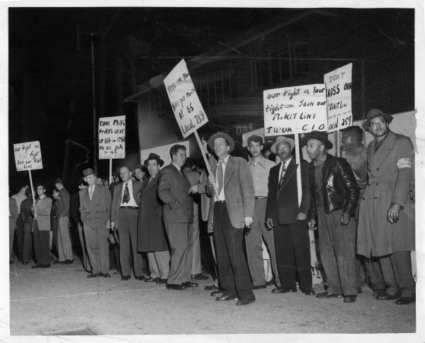 A picket line of men protesting the Cone Mills White Oaks Plant.