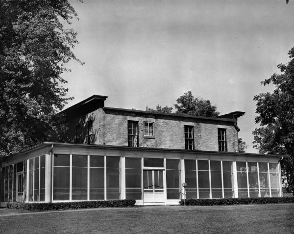 A view of the back of the Monona Golf Course Club House (aka Nathaniel and Harriet Dean House, built in 1856) 4718 Monona Drive. The large screened porch was added ca. 1931.