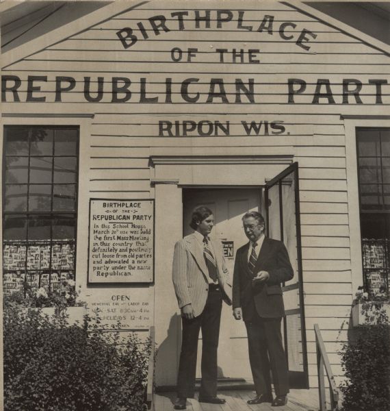 Wisconsin Governor Patrick J. Lucey standing with another man at the doorway of the Birthplace of the Republican Party in Ripon, Wisconsin.