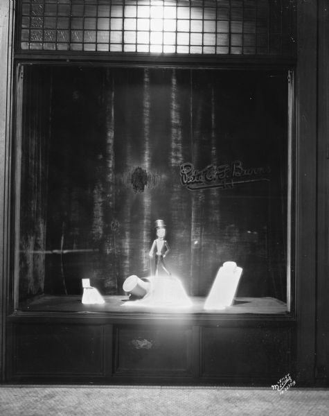 Prom window display showing top hat, formal shirt, and miniature mannequin, Pete E.F. Burns, 608 State Street.