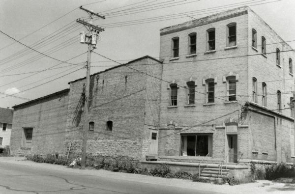 Exterior view from street of the Winz Brewery at 101-105 Manitowoc Street. 