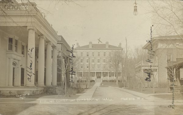 View up Sterling Court towards Chadbourne Hall, which is marked with a handwritten "X." Sorority houses, also identified by handwriting, are on both sides of the street. Caption reads: "Stirling Court and Chadbourne Hall, Madison Wis."