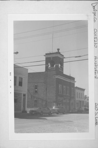 Exterior view of Hustisford City Hall at 210 South Lake Street. There is a siren on top of the building.