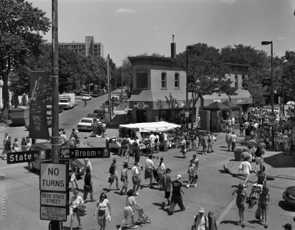Elevated view from State and Broom Streets of shoppers on State Street during the Maxwell Street Days sale.