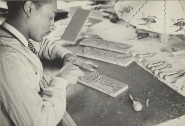 Caption reads: "The designs for draperies and wall hangings are cut into linoleum and backed with heavy ply-wood".