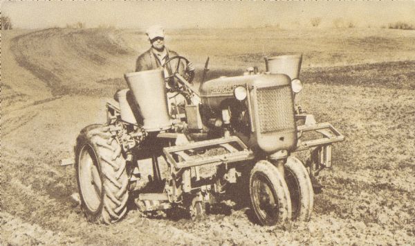 A man is driving a tractor. Caption reads: "First choice on thousands of farms is the versatile Allis-Chalmers MODEL 'C' TRACTOR with its matched line of front-mounted, hydraulically lifted, two-row planters, cultivators and fertilizer attachments. For full information, see your Allis-Chalmers dealer, or write Allis-Chalmers, Milwaukee, Wis." 
