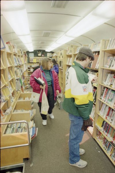 Patrons select materials in the Dane County Library Service Bookmobile.
