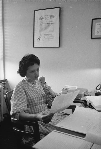 Shirley Abrahamson is sitting at her desk in an office while dictating.