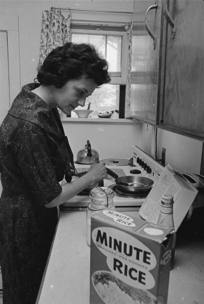Shirley Abrahamson in her kitchen preparing Minute Rice.