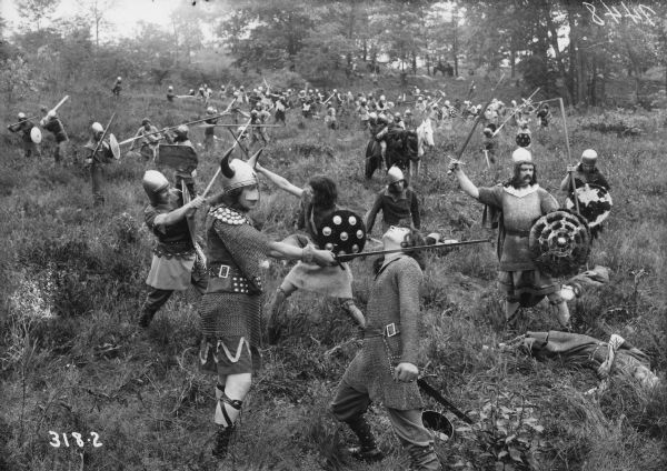 Still of actors portraying soldiers in a battle. Caption reads: "King Lear performance (for motion picture?)"