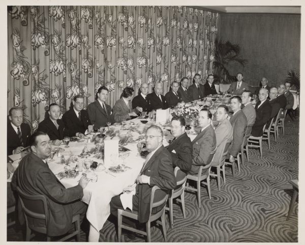 Newsmen, including Joseph Harsch and Paul Miller, attending a banquet held for Ernest J. King.